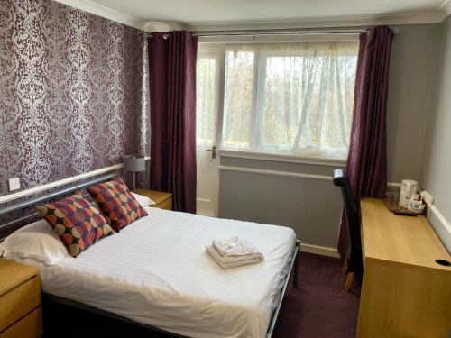 Posteľ alebo postele v izbe v ubytovaní Northumberland Hotel