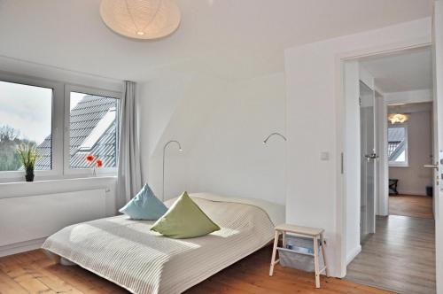 Ένα ή περισσότερα κρεβάτια σε δωμάτιο στο Kapitaen Clausen