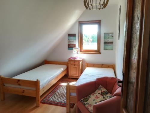 En eller flere senge i et værelse på Michałówka