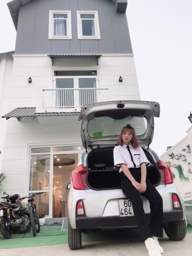 a woman sitting in the back of a car at Sele House in Ha Tien