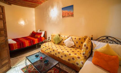 a living room with a couch and a table at Dar Najia in Fez