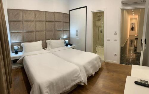 Säng eller sängar i ett rum på Ramel Hotel