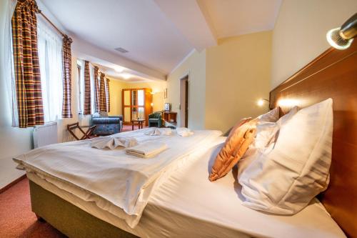 Postel nebo postele na pokoji v ubytování Hotel GOLFER
