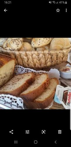 a basket filled with bread and a bunch of sandwiches at B&B Attico Mare in San Benedetto del Tronto