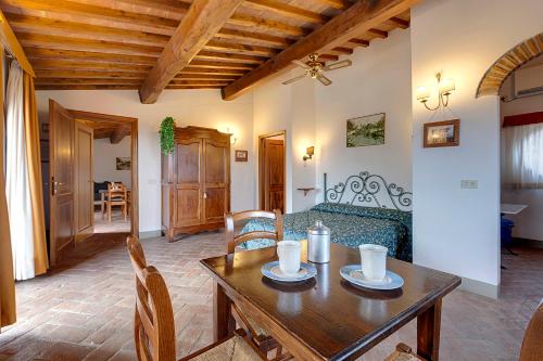 a living room with a table and a couch at Agriturismo La Presura in Strada