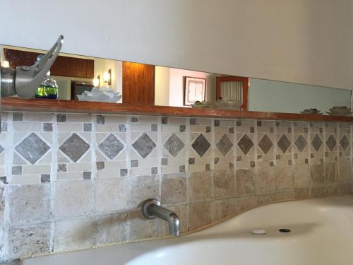 a bathroom with a sink and a mirror at Quinta Luna in Cholula