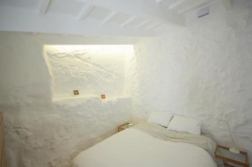 Ein Bett oder Betten in einem Zimmer der Unterkunft S'Olivera
