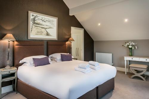 En eller flere senge i et værelse på The Penthouse @ Carus Green