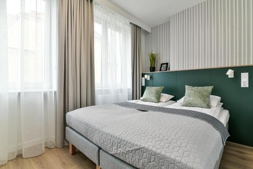 Postel nebo postele na pokoji v ubytování Old Town LTC - Apartments Starówka Tobiasza