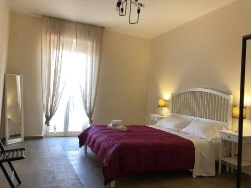 A bed or beds in a room at Lettera Living Penthouse