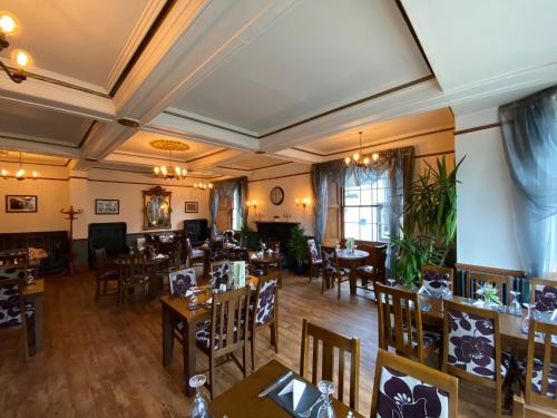 an overhead view of a restaurant with tables and chairs at The Hand Hotel Llangollen by Compass Hospitality in Llangollen