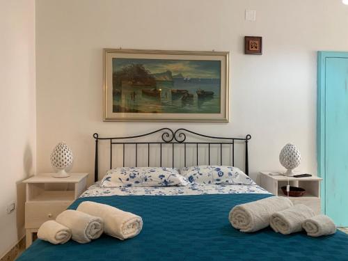 a bedroom with a bed with two pillows on it at fiori catene tra le torri in Conversano