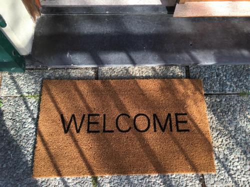 a welcome mat on the ground with the word welcome at L'ulivo in Levanto