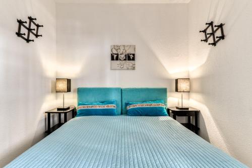 Ένα ή περισσότερα κρεβάτια σε δωμάτιο στο Arcadia Appartement - Vue sur Mer