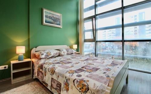 En eller flere senge i et værelse på Albatros Apartments