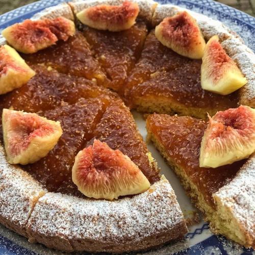 a close up of a cake with fruit on it at Agriturismo Cascina Rabalot in Diano dʼAlba