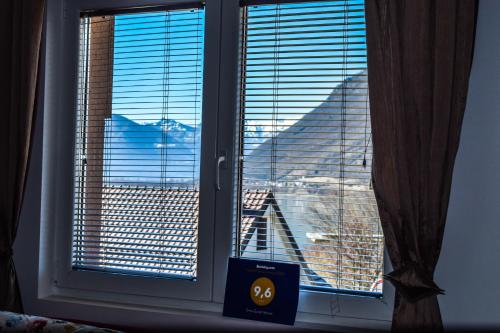 a window with a view of a city at Ema Guest House in Plav