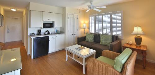 a living room with a couch and a table at Sanibel Inn in Sanibel