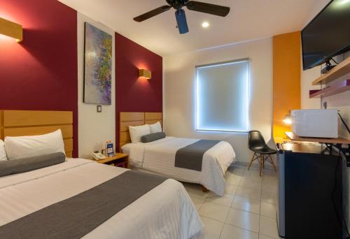 Ένα ή περισσότερα κρεβάτια σε δωμάτιο στο Hotel México Inn Express