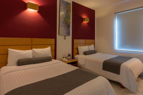 Cama o camas de una habitación en Hotel México Inn Express