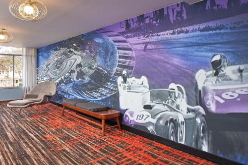 a room with a racing mural on the wall at Carmel Mission Inn in Carmel