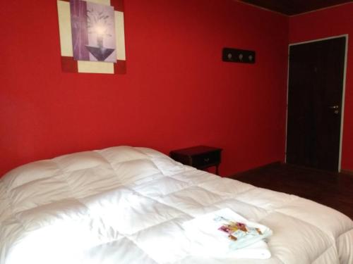 
A bed or beds in a room at La Antonieta Estancia de Mar
