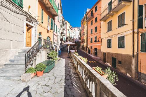 a city street filled with lots of buildings at 5 Terre Discovering in Riomaggiore
