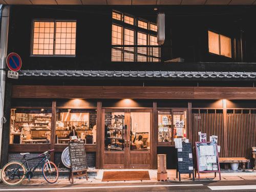 a store with a bike parked in front of it at 4S STAY Awaikeda Ekimae in Miyoshi