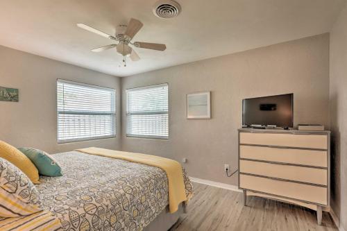 A bed or beds in a room at Bright Bungalow with Porch Walk to Ormond Beach!