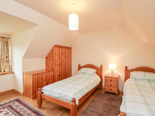 Кровать или кровати в номере Nantusi Cottage