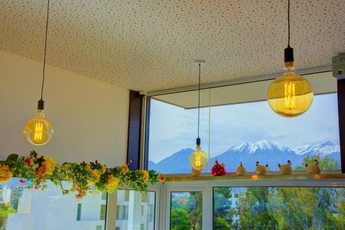a room with a window with a view of a mountain at Mint Hotel in Arequipa