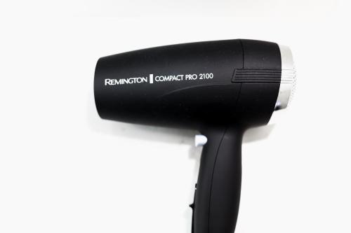 a black hair dryer on a white background at St Ives Apartments in Hobart