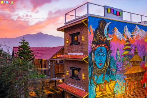 a painting of a building with graffiti on it at Flock Hostel Kathmandu in Kathmandu