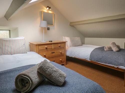 Ένα ή περισσότερα κρεβάτια σε δωμάτιο στο Barney's Cottage