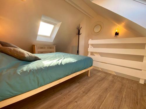 Llit o llits en una habitació de La Petite Maison De Bord De Mer