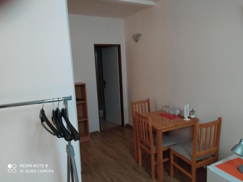 a kitchen with a table and chairs and a dining room at Břeclav centrum - U Pražáka in Břeclav