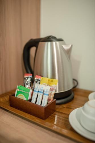 a tray with a tea kettle on a table at Nap in Chiangmai in Chiang Mai