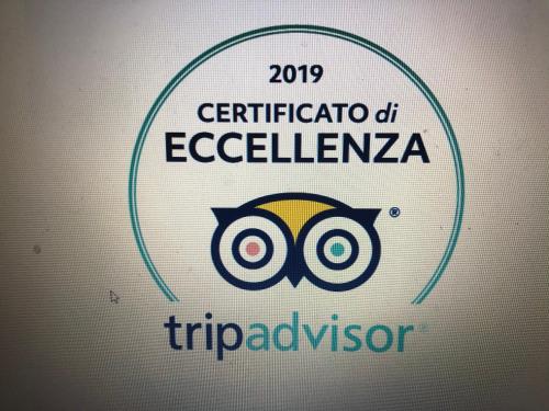 a sign for the observatory of eclecticism and the symbol of an owl at Il Giardino Di Adriana in Terracina