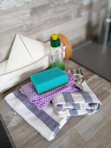 a table with a towel and a bottle of soap at Haus Strandburg Amrum in Wittdün