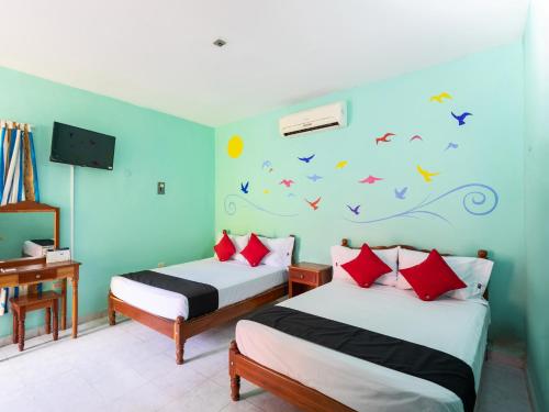 Cama ou camas em um quarto em Hotel Hacienda Bacalar
