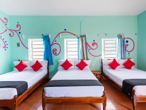 Postel nebo postele na pokoji v ubytování Hotel Hacienda Bacalar