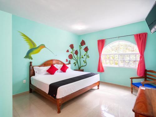 מיטה או מיטות בחדר ב-Hotel Hacienda Bacalar