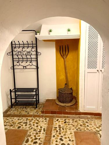 a kitchen with a fork and a wall with a door at Casa Cueva Castillo in Perales de Tajuña