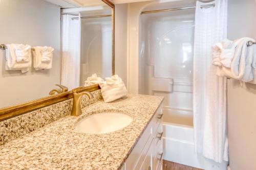 a bathroom with a sink and a shower at Seaside Retreat in Litchfield Beach