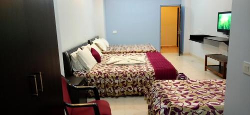 Una cama o camas en una habitación de Hotel Barbareek