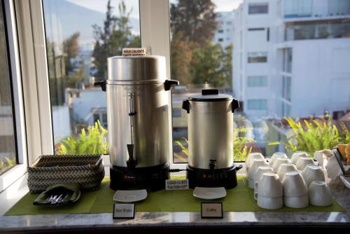 a blender sitting on a window sill in front of a window at Mint Hotel in Arequipa
