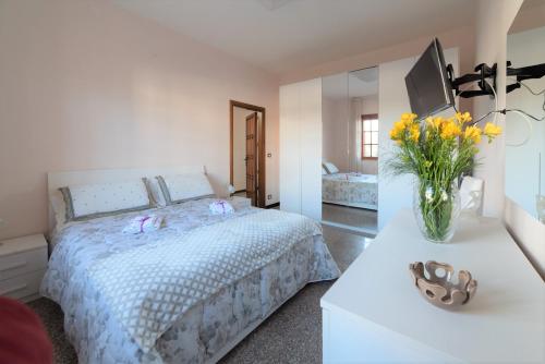 En eller flere senge i et værelse på Casa Vacanze Villa Chiara