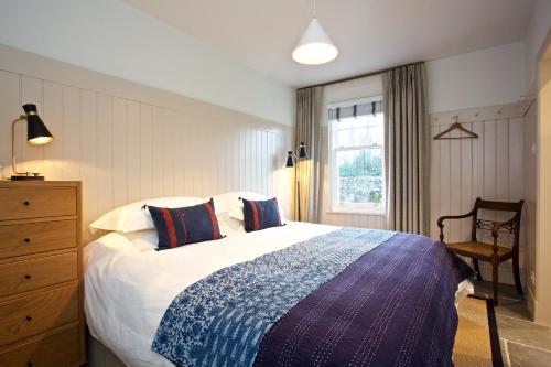 Postel nebo postele na pokoji v ubytování Ross Lodge