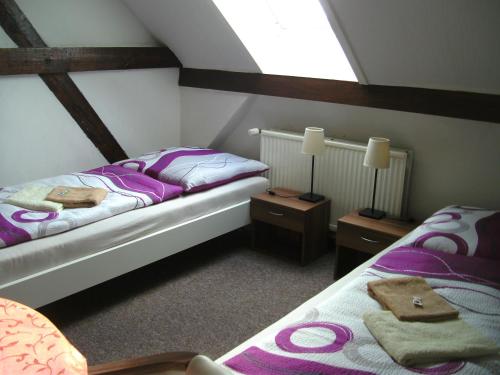 מיטה או מיטות בחדר ב-Pension an der Havel