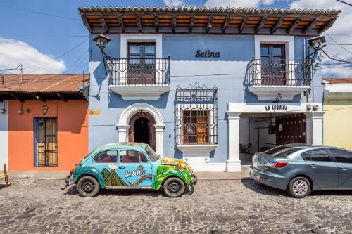 a car is parked in front of a building at Selina Antigua in Antigua Guatemala